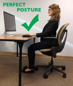 Perfect Desk Posture with feet flat on floor, straight back, and shoulders back